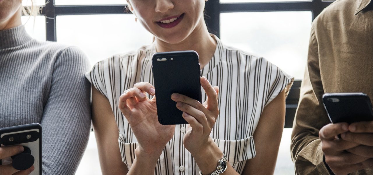 woman checking email on smartphone