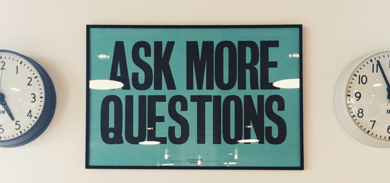 image of a a ask more questions sign